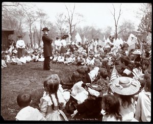 Children watching an entertainer on Arbor Day at Tompkins Square Park, New York, 1904